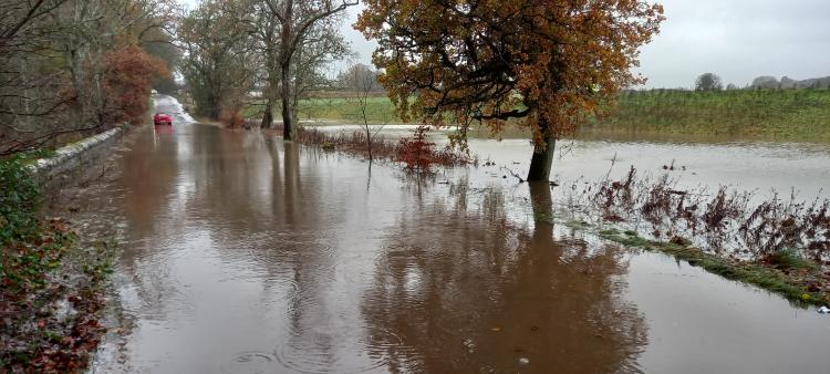 Image shows flooded road in Angus