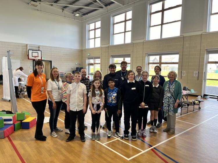 Employers, young people from P6 Hayshead Primary School and Convener of Family, Education and Justice Cllr Lynne Devine at a STEM careers event at Hayshead Primary School