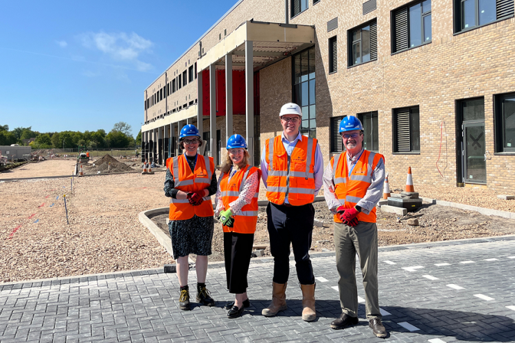 Angus Council’s Chief Executive Kathryn Lindsay, Angus Council’s Deputy Chief Executive Kelly McIntosh, Robertson Group Robbie Watson and Angus Council Leader Cllr George Meechan outside entrance to new Monifieth Learning Campus.